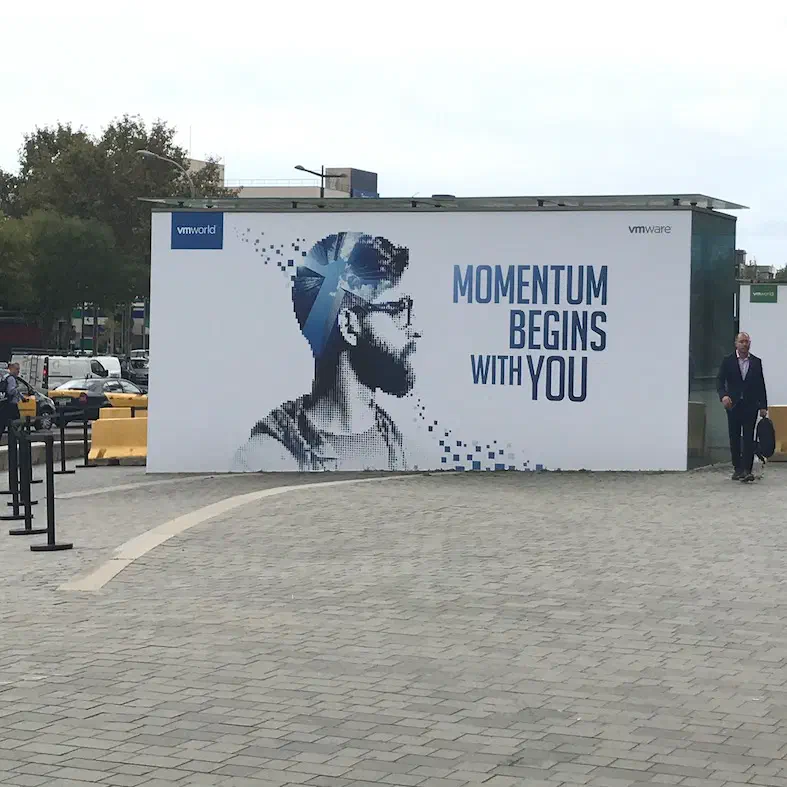 VMworld billboard reading Momentum Begins With You outside the Fira venue